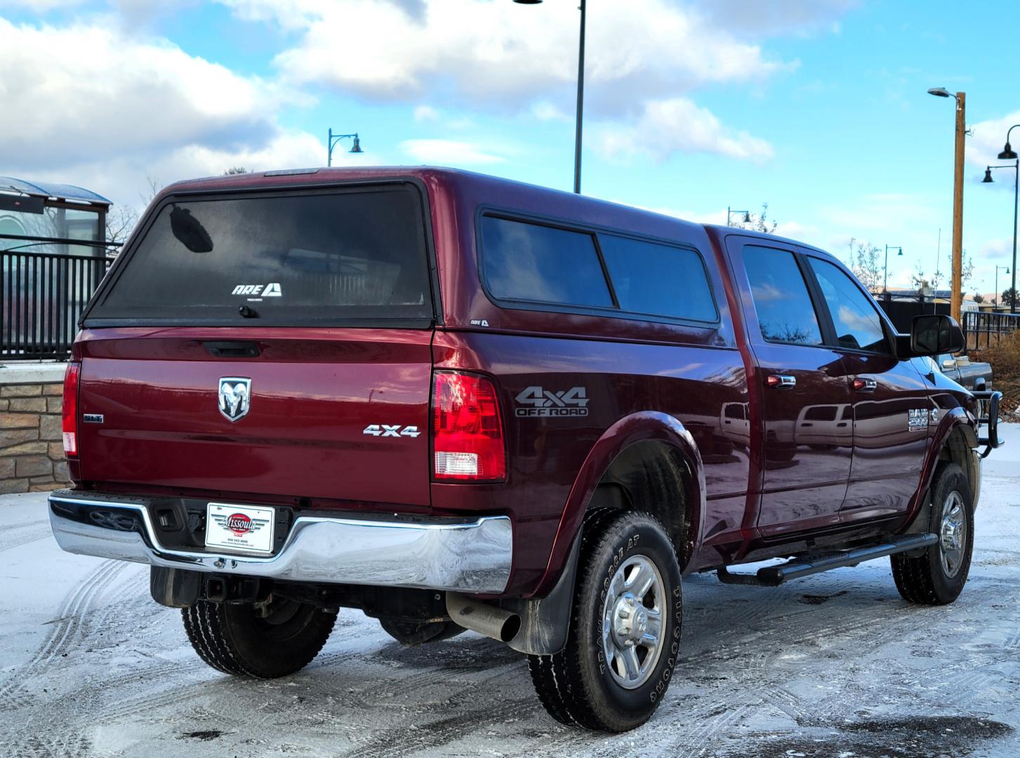 2018 Maroon /Black RAM 2500 SLT (3C6UR5DL4JG) with an 6.7 L Cummins Turbo Diesel engine, 6-Speed Automatic transmission, located at 450 N Russell, Missoula, MT, 59801, (406) 543-6600, 46.874496, -114.017433 - Only 12,839 Miles. Mint Condition/ 4 Wheel Drive. 6.7L Cummins Turbo Diesel. 6 Speed Automatic Transmission. Matching Topper. Touchscreen Display. AM FM Bluetooth. Power Drivers Seat. Air. Cruise. Tilt. Power Windows and Locks. Backup Camera. - Photo#5